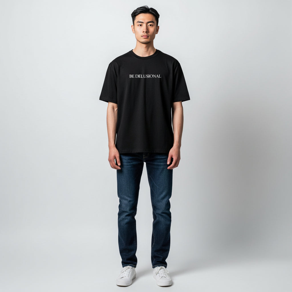 T-shirt “Be Delusional.”